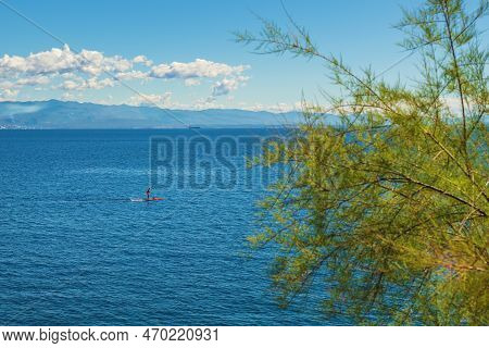 Unrecognizable Person Stand-up Paddle Boarding At Adriatic Sea Kvarner Gulf Seen From The Lovran Tow