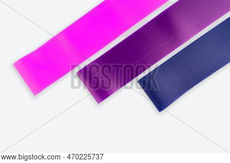 Fitness Elastic Band. Woman Showing A Blue Rubber Band. Sport And Healthy Active Lifestyle Concept. 