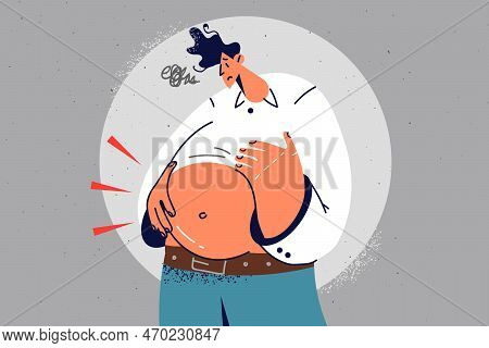 Overweight Man With Big Belly Suffer From Excessive Weight. Unhappy Obese Male Touch Abdomen Struggl