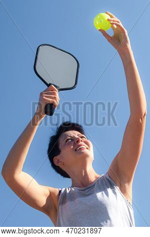 Woman Playing Pickleball Game, Hitting Pickleball Yellow Ball With Paddle, Outdoor Sport Leisure Act
