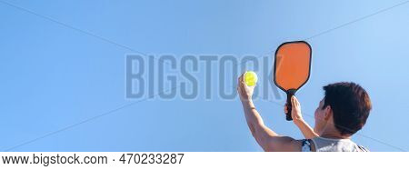 Pickleball Banner Over Blue Sky, Woman Playing Pickleball Game, Hitting Pickleball Yellow Ball With 