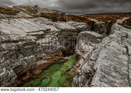 Autumn Mountain Landscape Of Rondane National Park In Norway, Waterfall Near Peer Gynt Hytta