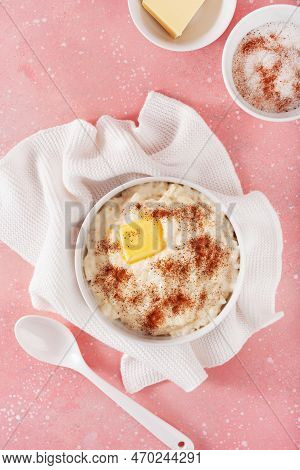 Rice Pudding With Butter Cinnamon. French Riz Au Lait, Norwegian Risgrot, Traditional Breakfast Dess