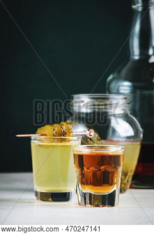 Pickleback, Alcoholic Cocktail Made From Cucumber Pickle And Whiskey In Small Shot Glasses. Hard Lig