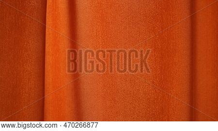 Plain Orange Fabric Drapery With A Smooth Wave In Relief Full Frame, Cotton Or Linen Material With A