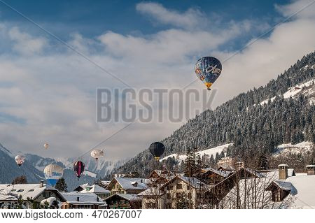 Chateau D'oex, Switzerland - January 29. 2023: Hot Air Balloons Flying. International Hot Air Balloo
