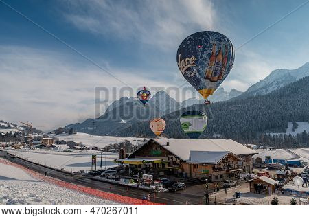Chateau D'oex, Switzerland - January 29. 2023: Hot Air Balloons Flying. International Hot Air Balloo
