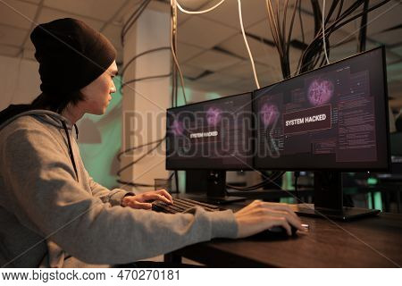 Asian Programmer Solving Database Server Cyberattack, System Hacked Alert On Computer Screen, Intern