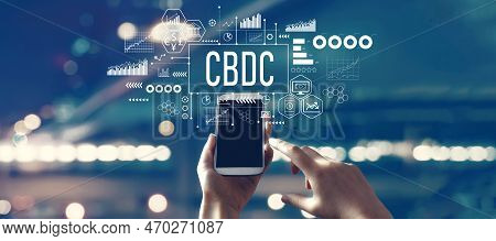 Cbdc - Central Bank Digital Currency Concept With Person Using A Smartphone