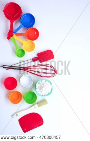 Top View Set Of Kitchen Utensils And Ingredients For Bakery On White Background. Materials Or Kitche