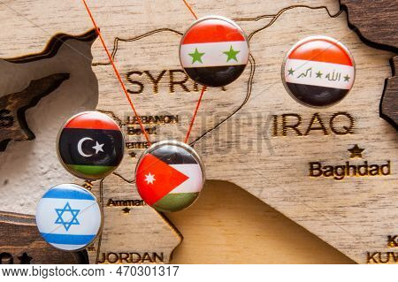 Syria, Iraq, Israel, Libanon, Iran Flags On The Push Pins And Red Thread On The Wooden Map, Close Up