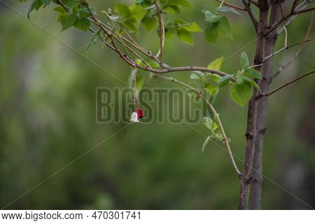 Symbol Of The First Day Of Spring Martisor. Tradition Of Giving Red And White Souvenir. Copy Space