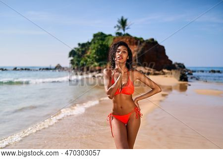 Portrait Of Serene Looking Fit Attractive Young Black Female Posing In Bikini At Exotic Beach By Oce