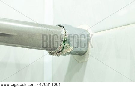 Leakage Of Water From The Heated Towel Rail In Places Of Threaded Connections On The Background Of W