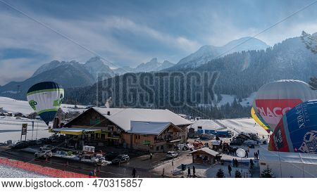 Chateau D'oex, Switzerland - January 29. 2023: Hot Air Balloons Flying. International Hot Air Balloo