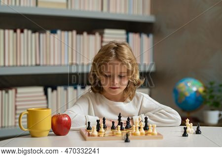 Child Boy Developing Chess Strategy, Playing Board Game. Intelligent And Smart Kids. Games Good For 