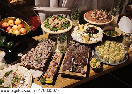 Catering Table Background. Wedding Decorative Ham Slices. Cheese Snack. Cheese Tray. Various Meat Sn