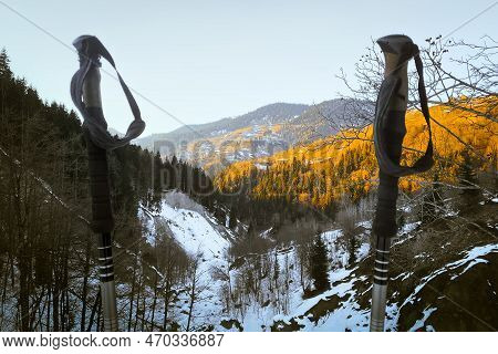 Close Up Black Grey Hiking Poles On Hike With Mountains Panorama In Spring
