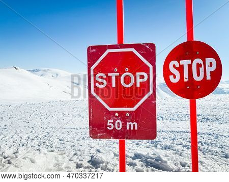 Avalanche Danger Sign Post In Snowy Mountains In Georgia. Goderdzi Winter Resort In Georgia Caucasus
