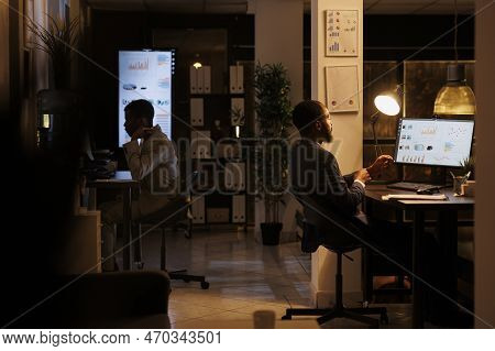 Corporate Worker Working Overhours At Marketing Strategy, Analyzing Company Statistics Graph. Entrep