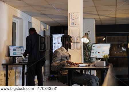 Entrepreneur Looking At Financial Graphs Report On Computer, Planning Company Investment Typing Busi