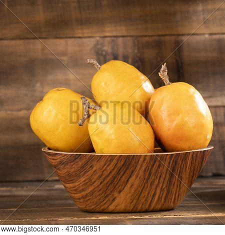 Jocote Exotic Fruit In The Wooden Bowl- Spondias Purpurea