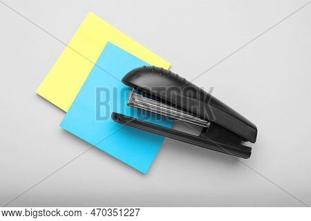 New Bright Stapler With Sticky Notes On Light Grey Background, Flay Lay