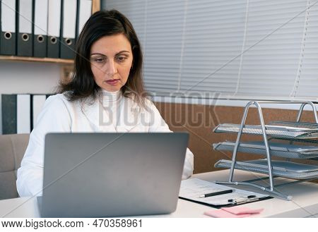 Attractive Serious Doctor Therapist Videoconferencing To Web Camera. Telemedicine Concept. Online Do