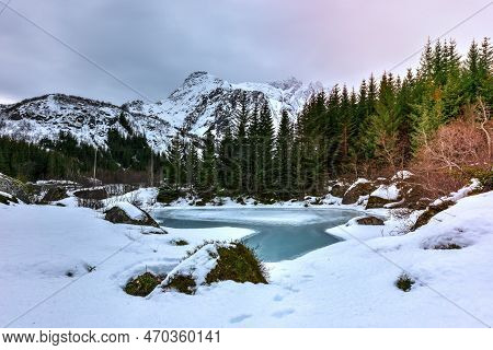Storvatnet Lake In Front Of The Landscape Of The Lofoten Mountains On The Island Flakstadoy In The W