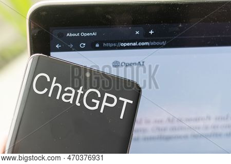 Mobile Phone With Website Of Us Artificial Intelligence Company Openai Llc On Screen In Front Of Bus