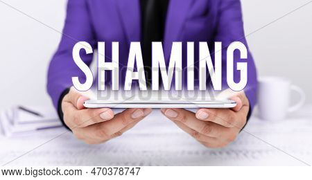 Handwriting Text Shaming. Word Written On Subjecting Someone To Disgrace, Humiliation, Or Disrepute 