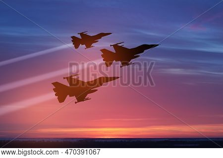 Air Force Day. Aircraft Silhouettes On Background Of Sunset. Combat Flight Of Interceptors On A Miss