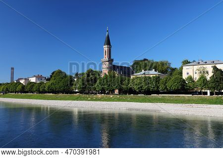 Salzburg, Austria. City View With Elisabethkai Riverfront And Evangelical Parish Church.