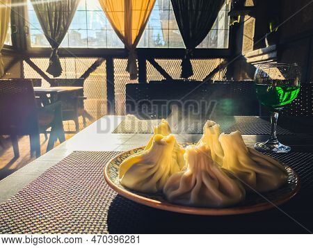 Batumi, Georgia - 22nd January, 2023: Traditional Georgian Dish, Khinkali Kalakuri, On A Wooden Tabl