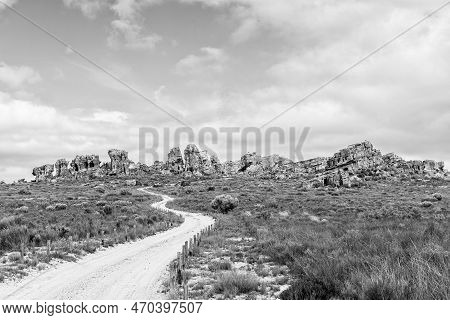 Rock Formations At The Stadsaal Caves In The Western Cape Cederberg. The Road To The Caves Is Visibl