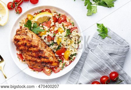 Grilled Chicken Breast Fillet With Tabbouleh Salad With Bulgur, Tomato And Parsley With Lemon Dressi