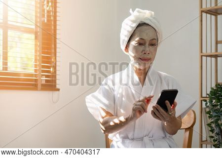 Senior Woman Facial Spa And Skin Care Concept At Home
