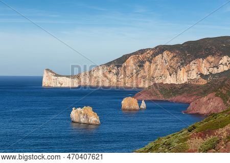 Rocky Cliffs On The Sea Coast. Sardinia, Italy. Nature Background