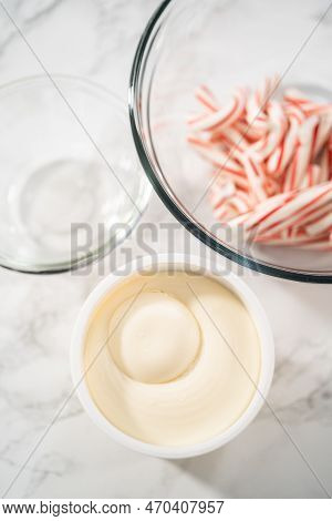 Measured Ingredients In A Glass Mixing Bowl To Prepare Peppermint Buttercream Frosting.