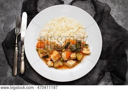 Squid Stew With Vegetables And Boiled Rice On White Plate