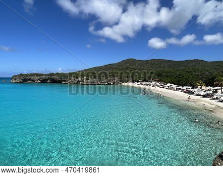 Grote Knip Beach View Of Crystal Clear Blue Green Water In The Carribean With A Blue Sky Back Ground