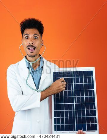 Doctor Or Veterinarian Isolated On Orange Background. Black Young Doctor Medical Resident With Steth
