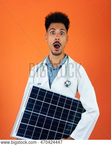 Doctor Or Veterinarian Isolated On Orange Background. Black Young Doctor Medical Resident With Steth