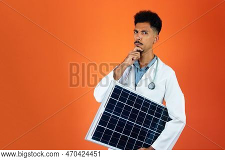 Doctor Or Veterinarian Isolated On Orange Background. Black Young Doctor Medical Resident With Steth