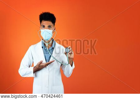 Doctor Or Veterinarian Isolated. Black Young Doctor Medical Resident With Stethoscope And Pandemic M