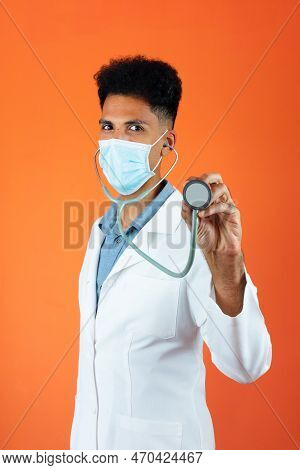 Doctor Or Veterinarian Isolated. Black Young Doctor Medical Resident With Stethoscope And Pandemic M