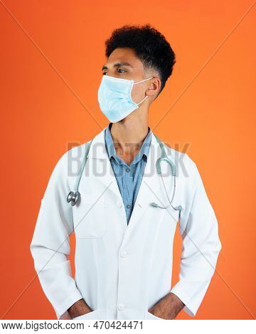 Doctor Or Veterinarian Isolated. Black Young Doctor Medical Resident With Stethoscope And Pandemic M