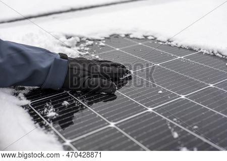 Solar Panel In Winter Time. Getting Electricity With Solar Panels In Winter.hands In Gloves Clear Sn