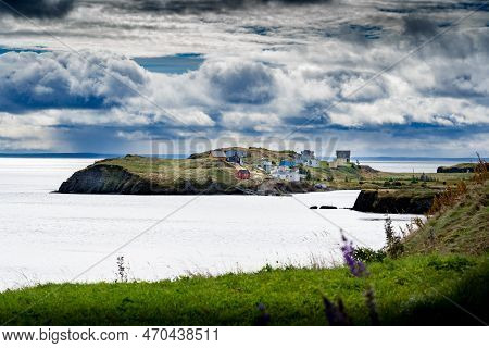 Scenic Landscape Of Small East Coast Homes On A Peninsula Overlooking High Cliffs Along The Atlantic