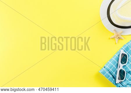 Beach Hat With Shorts And Sunglasses On Yellow Background. Flat Lay. Summervacation Concept. Starfis